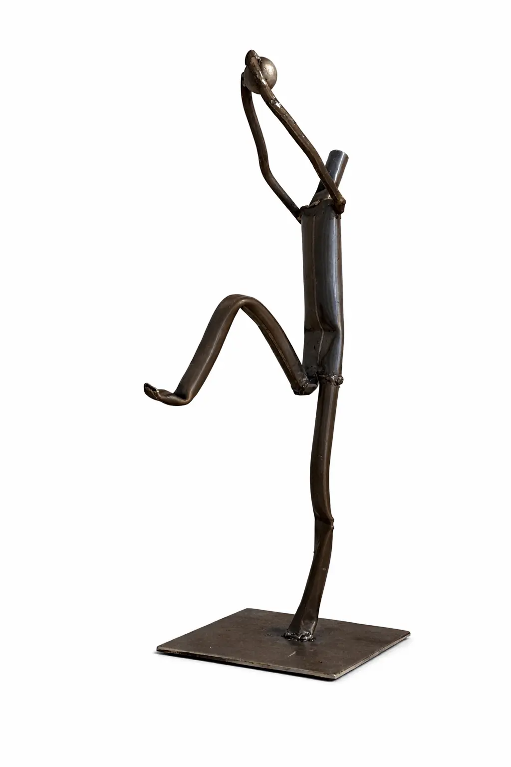 Handmade metal sculpture of basketball player from a side